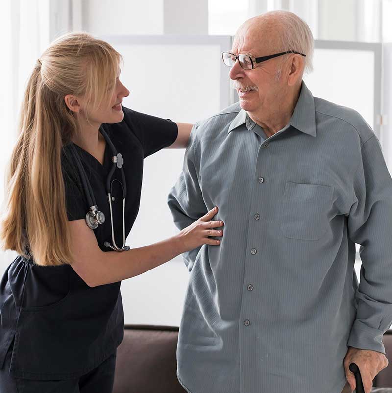 Nurse comforting patient at home
